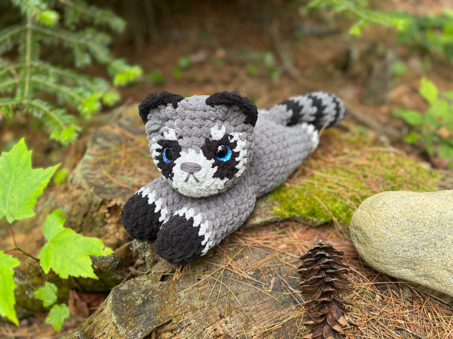 Laying Down Raccoon Crochet Plushie | Hand Painted Eye