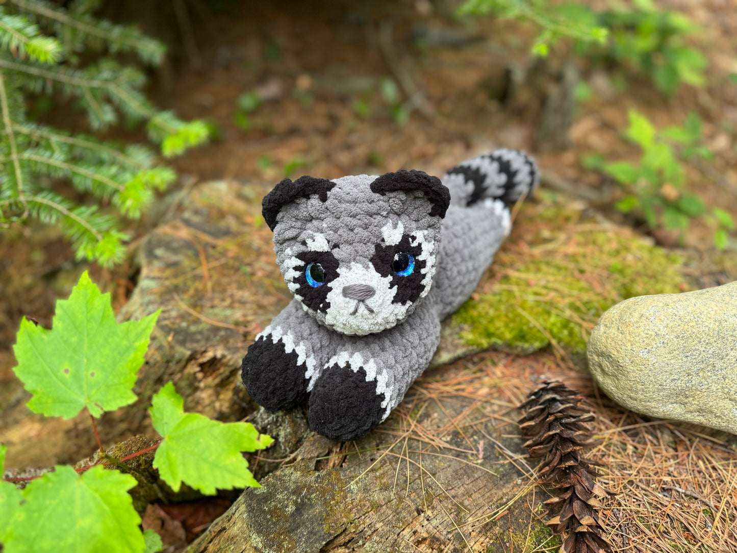 Laying Down Raccoon Crochet Plushie | Hand Painted Eye