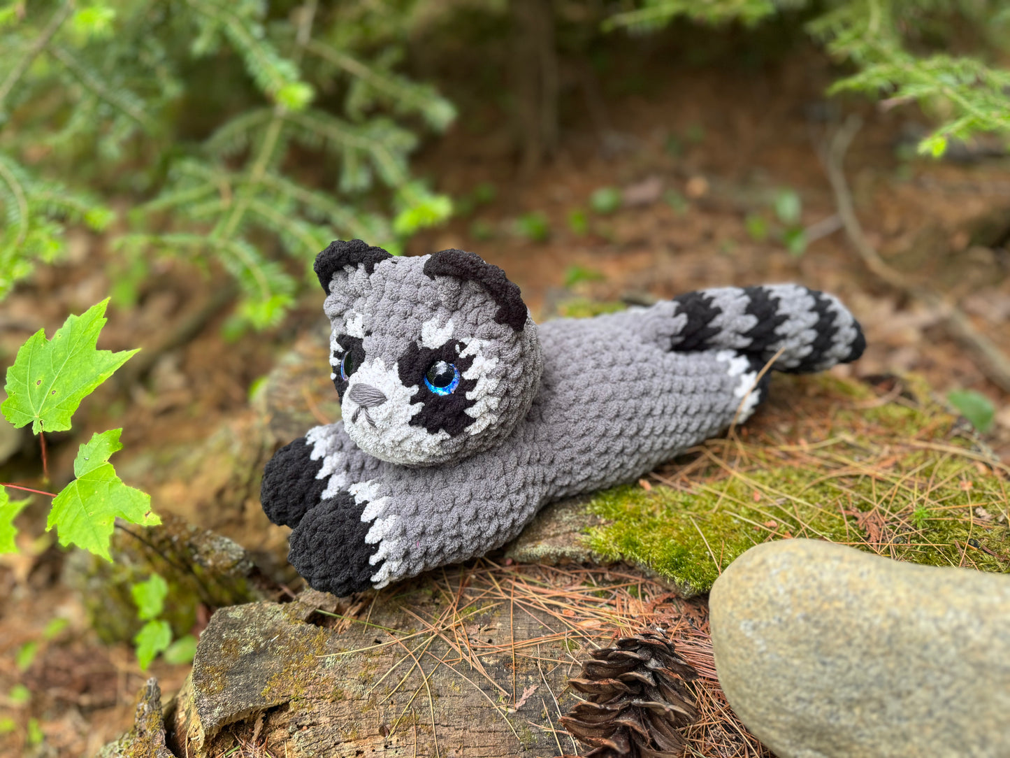Laying Down Raccoon Crochet Plushie | Hand Painted Eye